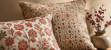 Textured cushions and a considered decorative arrangement
